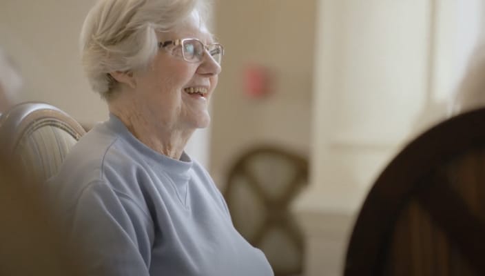 Senior resident smiling during an activity