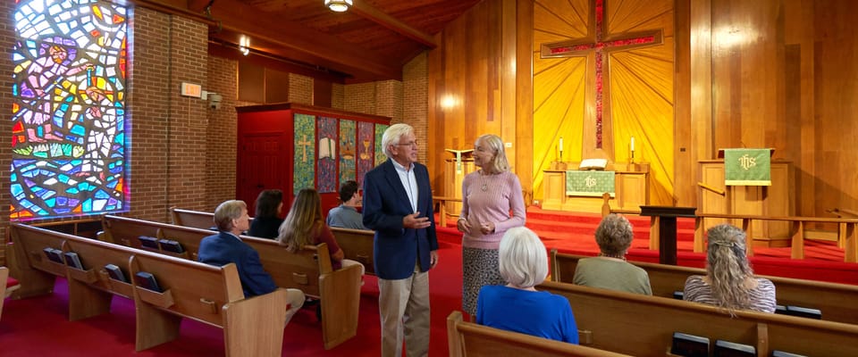 Residents and staff interacting in the chapel area