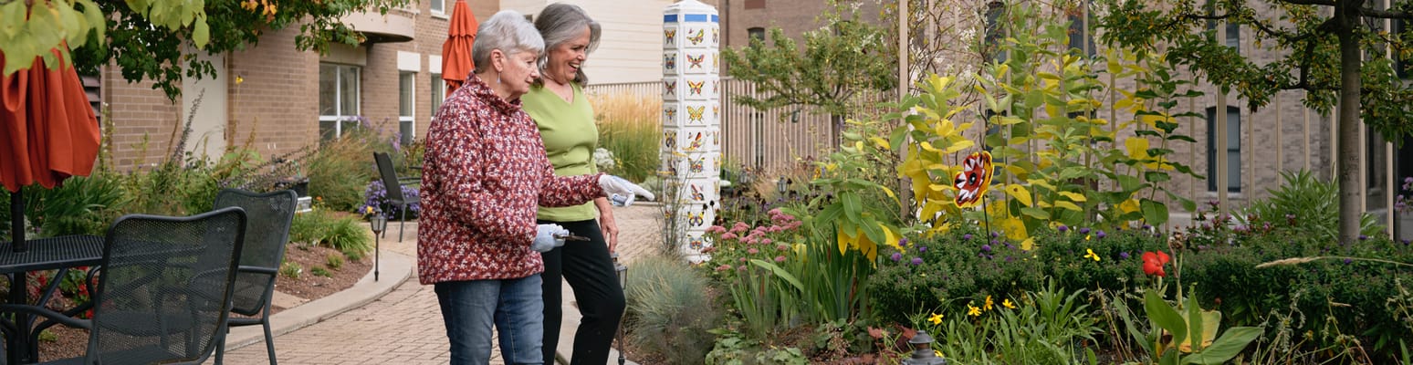 Residents enjoying gardening in a vibrant outdoor area