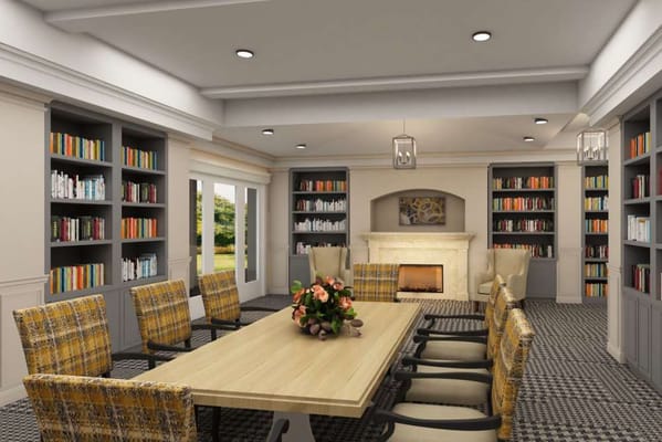 Bright common area with seating and shelves