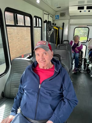 A resident on a shuttle bus in the facility.