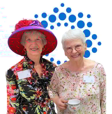 Two smiling residents in a common area