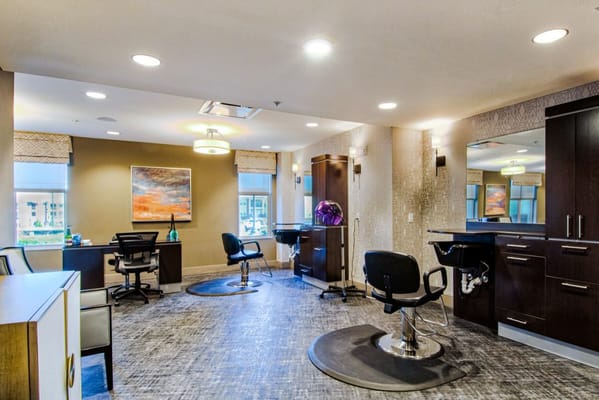 Interior view of a salon area with styling chairs