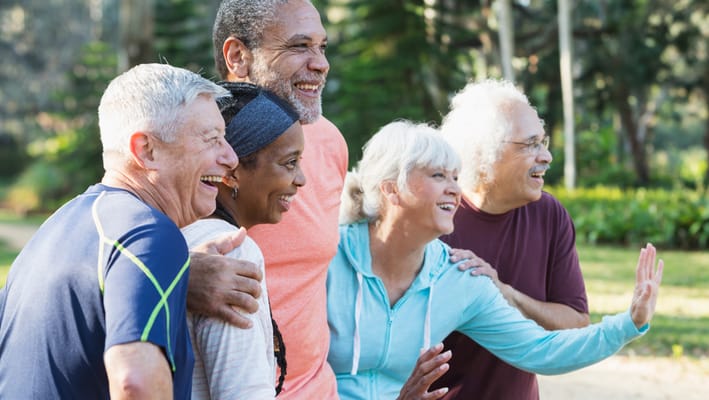 Group of residents enjoying a day outside in the garden