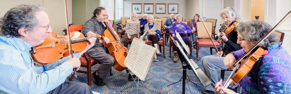 Residents enjoying a live music performance in a common area