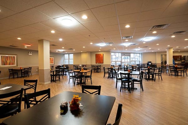 Dining area with multiple tables and chairs