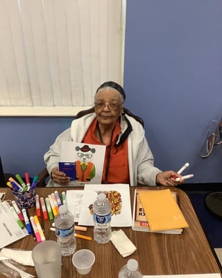 Resident participating in an arts and crafts activity