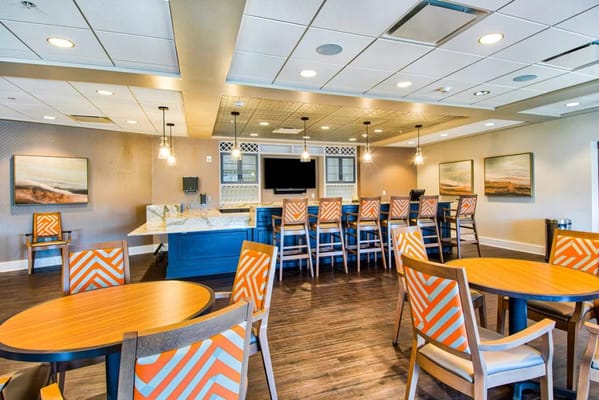 Bright dining area with modern decor and seating