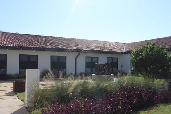 Outdoor space with landscaping in front of facility