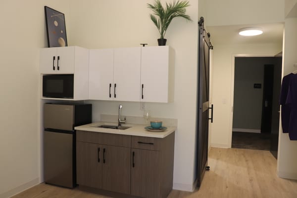 Interior view of a resident room with kitchenette