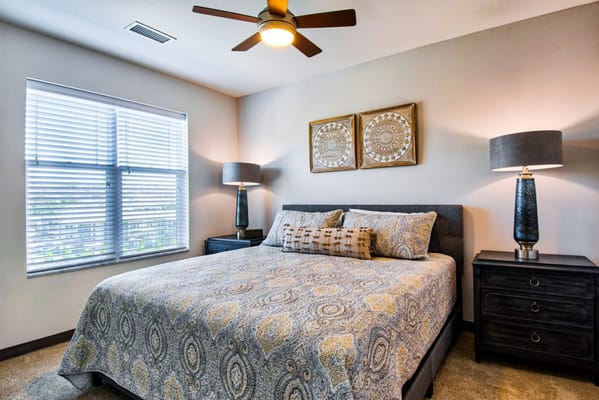 Well-decorated bedroom with a large bed and lamps