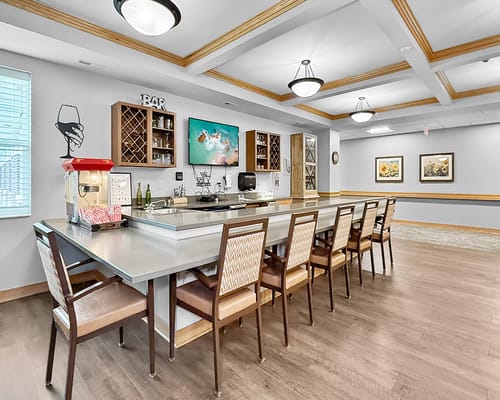 Bright common area with a bar and seating