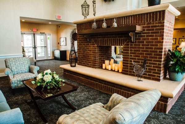 Cozy lounge area with fireplace and seating