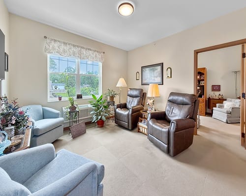 Cozy interior lounge with comfortable seating and plants