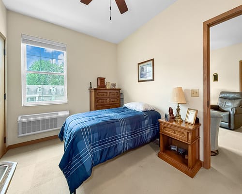 Cozy private room with a bed and furniture