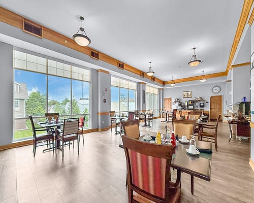 Interior dining room with natural light and seating