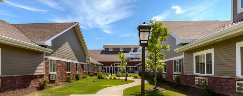 Well-maintained pathways and gardens in a senior living facility