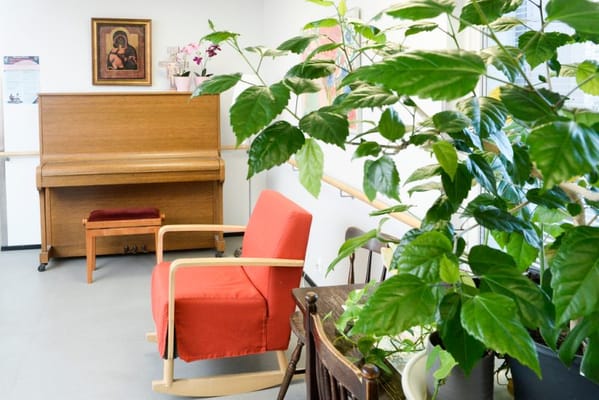 Interior view of a cozy lounge area with a piano