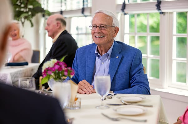 Resident enjoying a meal in the dining room