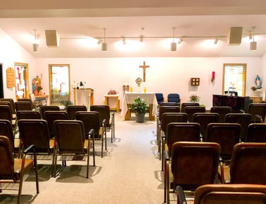 Interior of a chapel with chairs and altar
