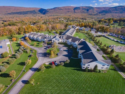 Aerial view of senior living facility surrounded by nature