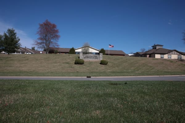 The Willows at Springhurst building with signage amidst greenery