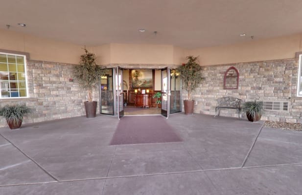 Entrance of a senior care facility with a welcoming atmosphere