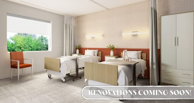 Renovated patient room with beds and seating area