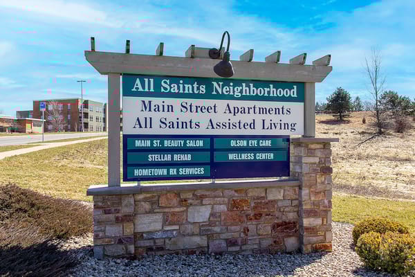Signage for All Saints Neighborhood facility and its services