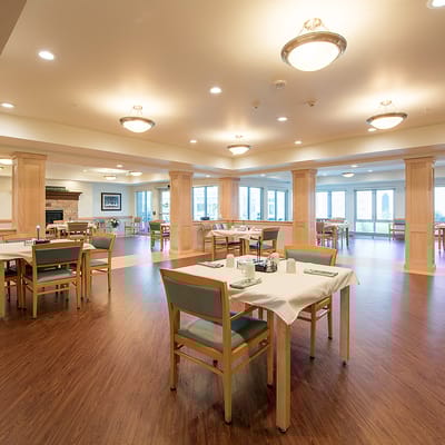Bright dining area with tables and chairs