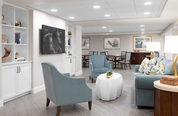 Bright common area with seating and entertainment