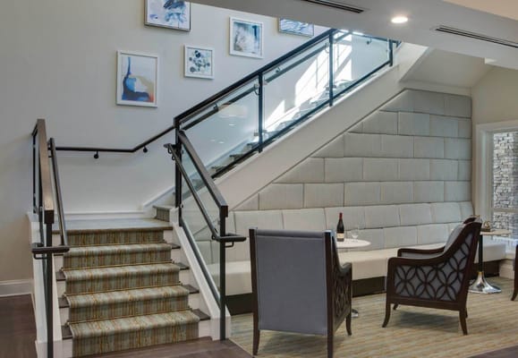 Interior staircase with seating area and artwork
