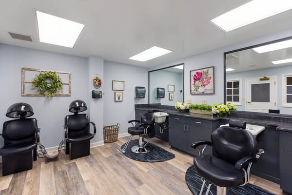 Modern hair salon area with styling chairs