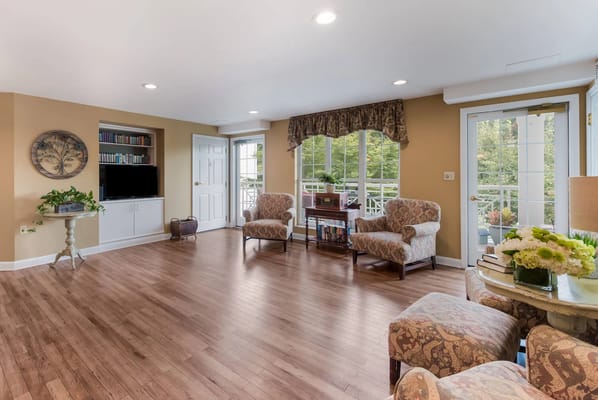 Bright common area with seating and natural light