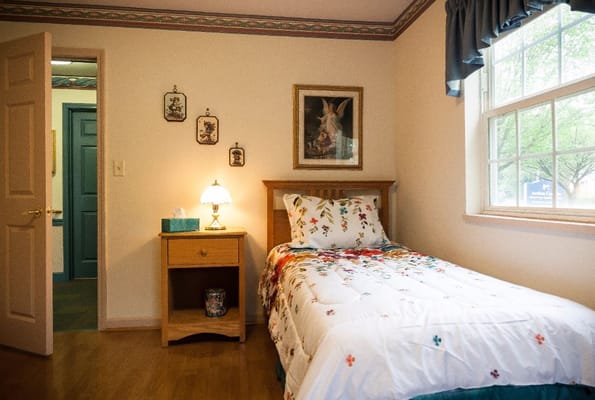 Cozy private resident room with floral bedding