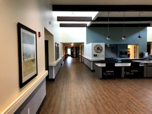 Interior hallway with kitchen area visible