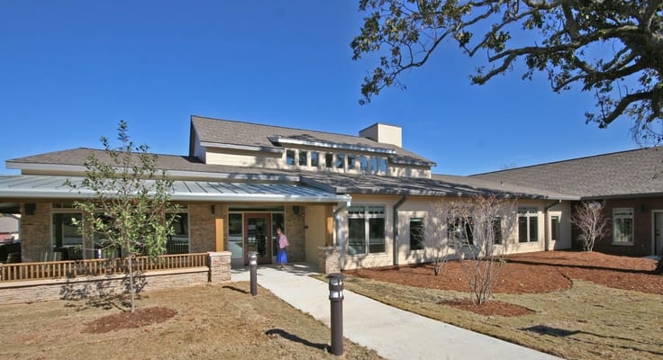Exterior of Arkansas State Veterans Home with landscaped grounds.