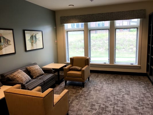 Cozy common area with seating and natural light
