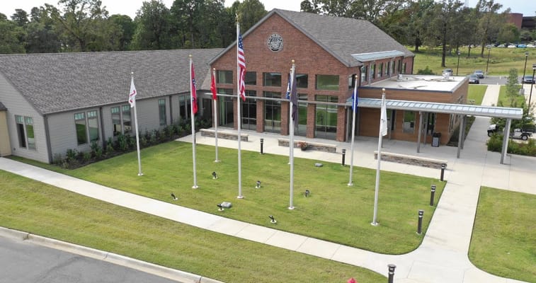 Aerial view of the Arkansas State Veterans Home facade and flagpoles