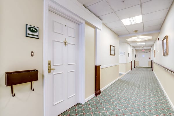 Interior hallway leading to a resident room