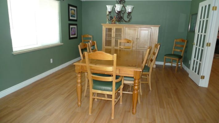 Dining area with wooden table and chairs