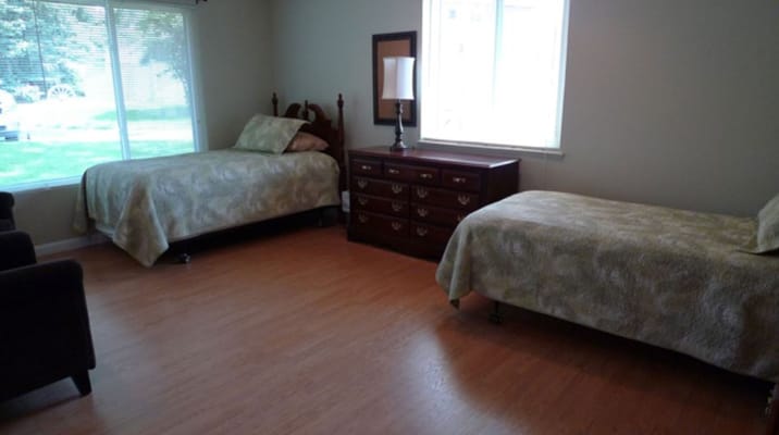 Cozy interior room with two beds and a dresser