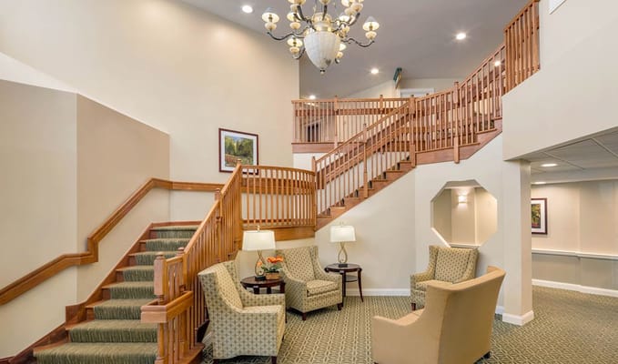 Inviting common area with comfortable seating and stairway