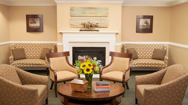 Cozy lounge area with seating and flowers