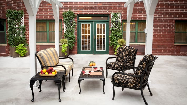 Outdoor seating area with fruit and drinks