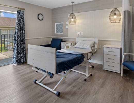 A well-furnished private resident room in a nursing home