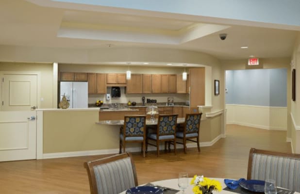 Interior view of a dining area with kitchen access