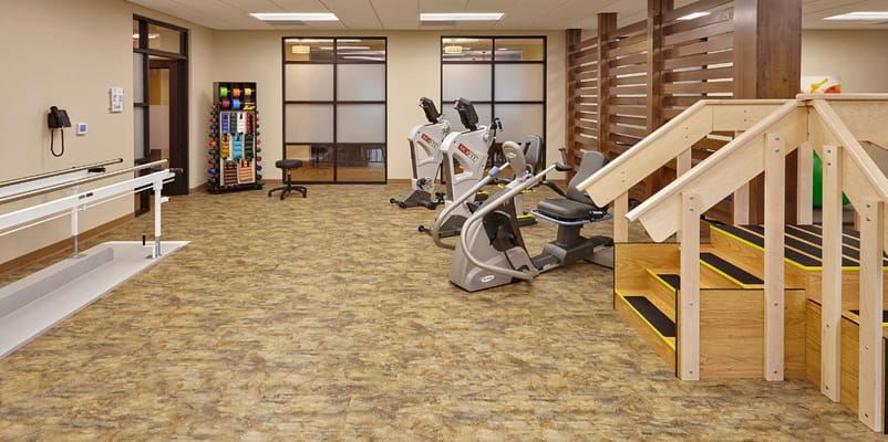 Rehabilitation area with exercise equipment and stairs