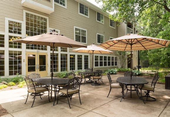 Outdoor patio area with tables and umbrellas