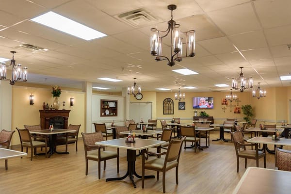 Bright dining area with tables and chairs